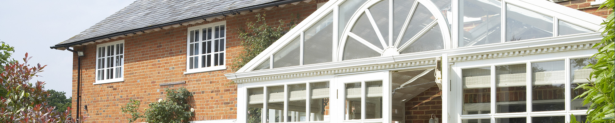 close up top of conservatory with white upvc trim