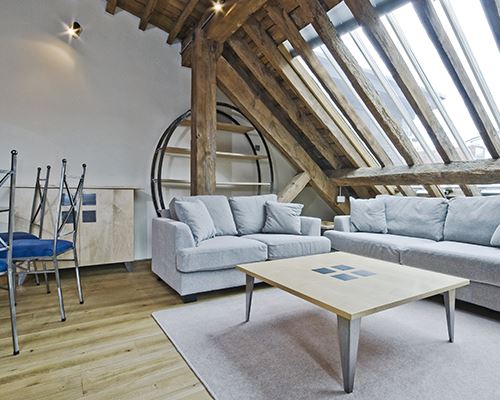 loft conversion wooden banners with modern grey furniture